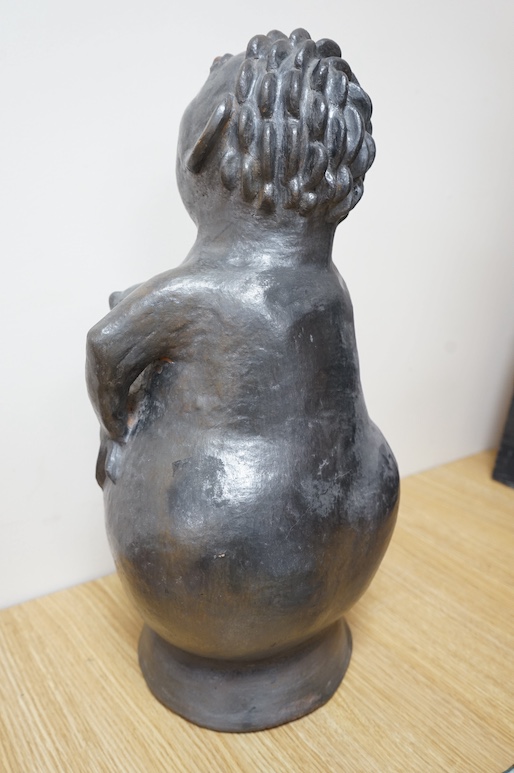 An African clay sculpture of a woman by Jesserina Chamisa, 52cm high. Condition - good